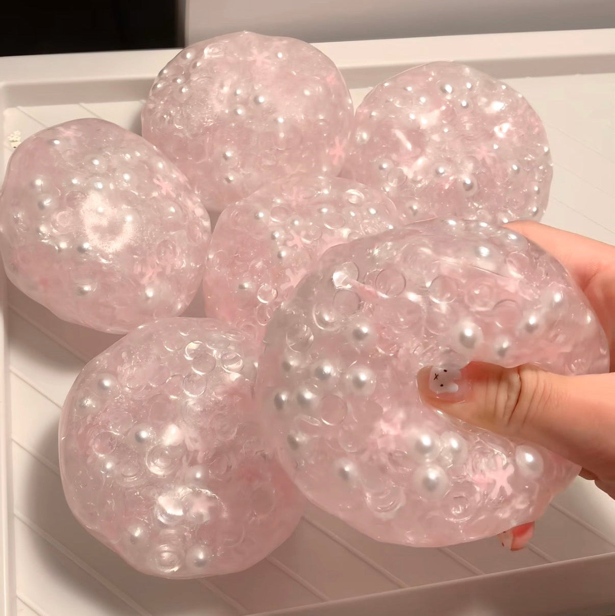 dreamy jelly pearl stress ball with soft flowing texture