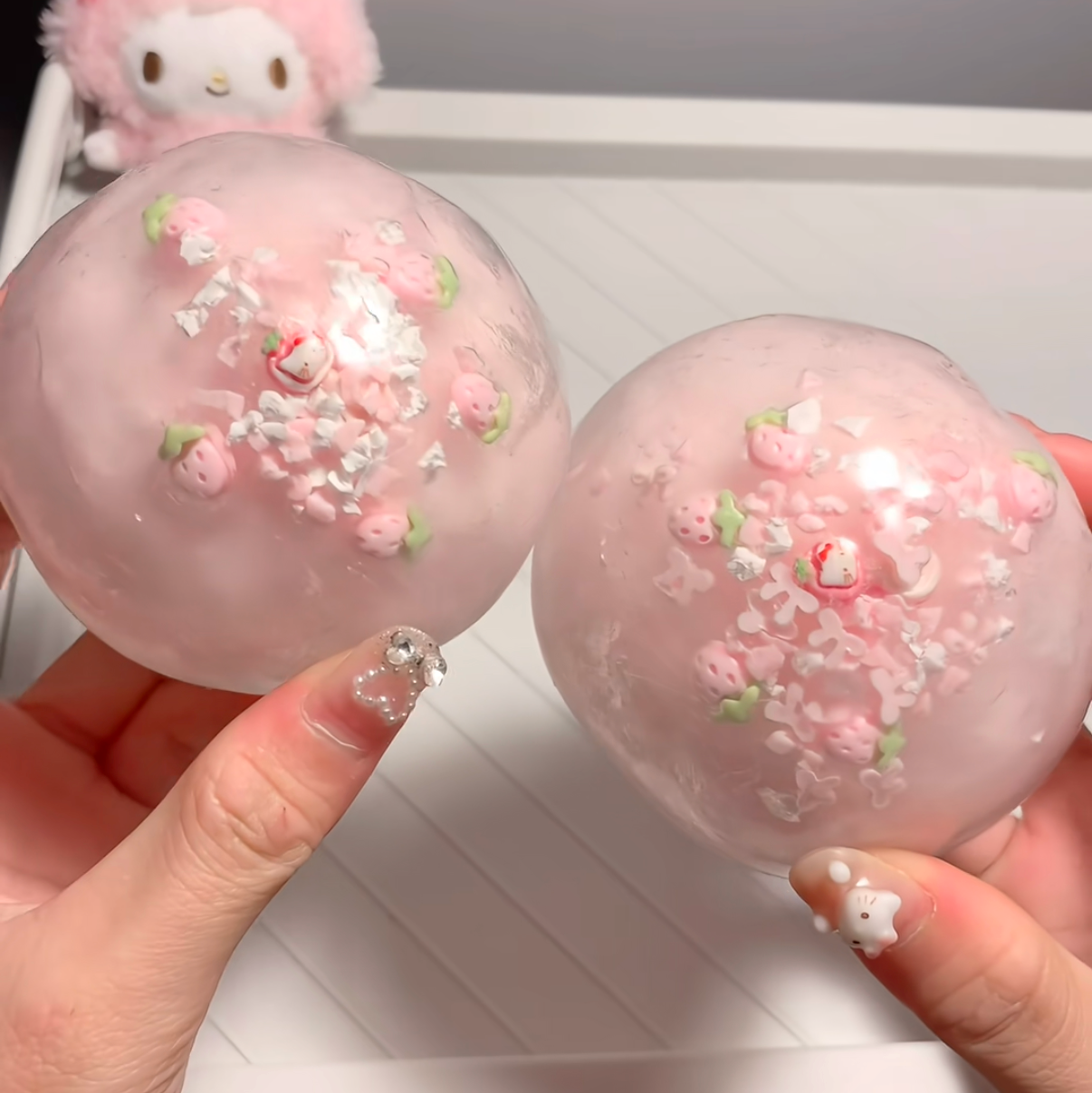 pastel berry cracking stress ball with strawberry decorations