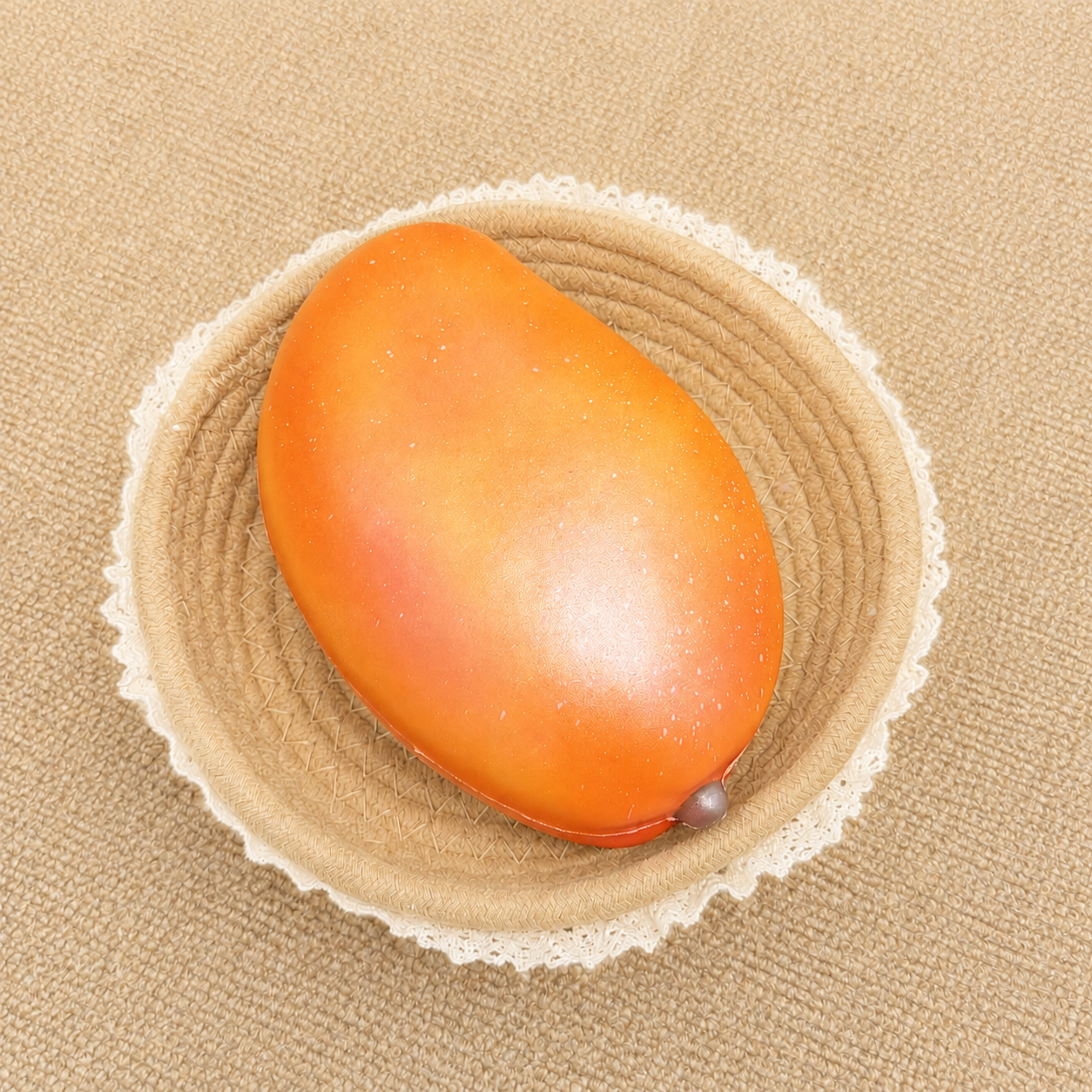 Glitter mango slow rising squishy with a colorful fruit design and soft foam texture