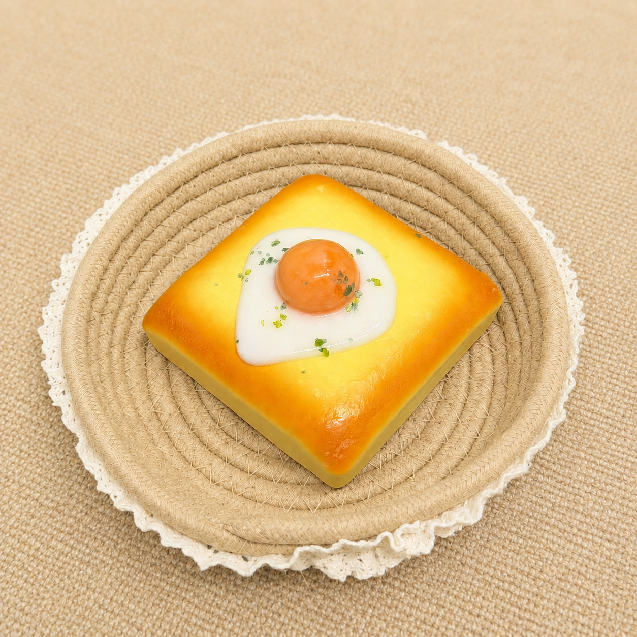 Toast with fried egg topping slow rising squishy with realistic food details.
