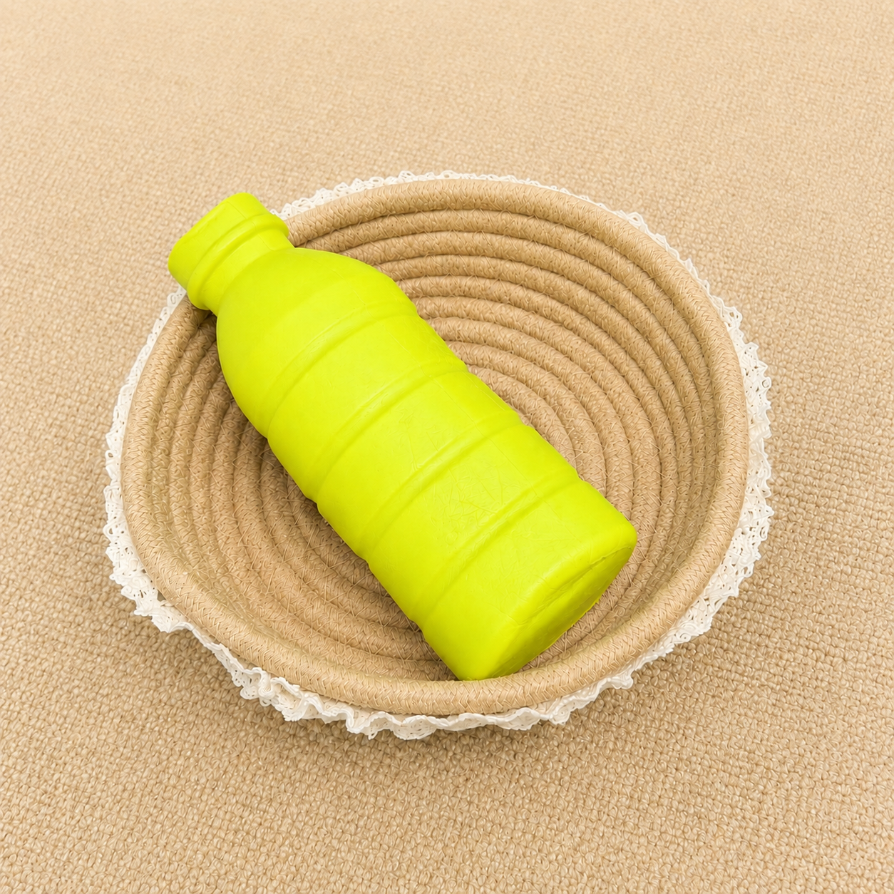 Green bottle shaped slow rising squishy with soft foam texture.