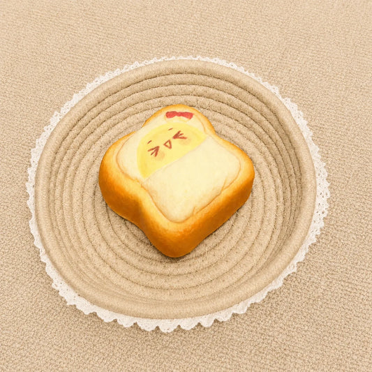 Emoji toast slow rising squishy with cute face design and soft bread texture.